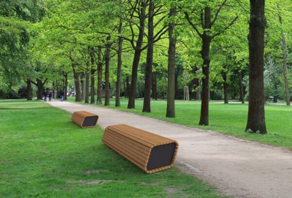 Park bench on path in green park