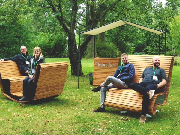 Outdoor bench at the grass for a landscape exhibition in 2021